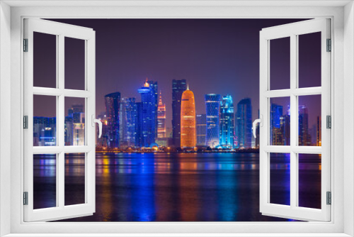 Fototapeta Naklejka Na Ścianę Okno 3D - Illuminated skyline of Doha at night, Qatar, Middle East.