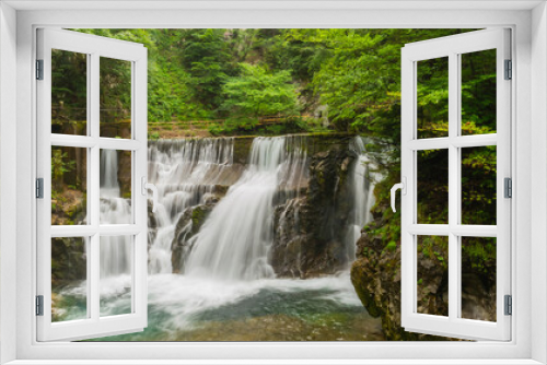 Fototapeta Naklejka Na Ścianę Okno 3D - Vintgar gorge, Slovenia. River near the Bled lake with wooden tourist paths, bridges above river and waterfalls. Hiking in the Triglav national park. Fresh nature, blue water in the forest.
