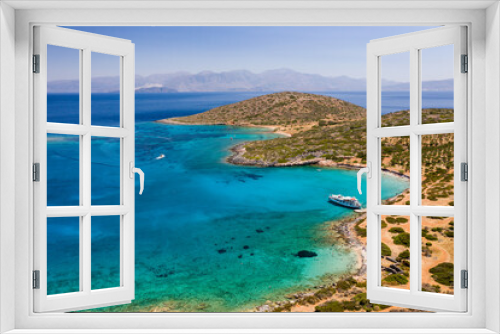 Fototapeta Naklejka Na Ścianę Okno 3D - Aerial view of a crystal clear blue ocean and hot, summer landscape with tourist boats (Crete, Greece)