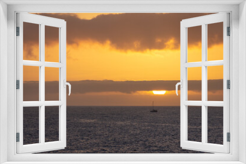 Fototapeta Naklejka Na Ścianę Okno 3D - sunset over the sea with a boat at the horizon