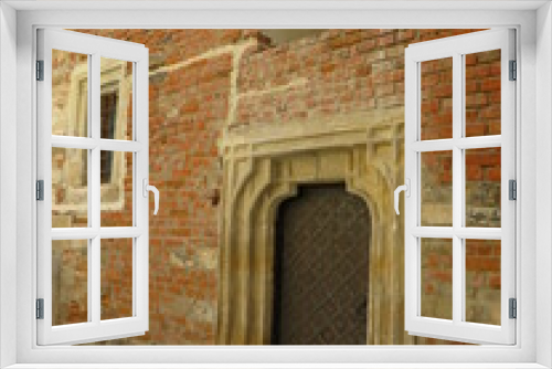 Fototapeta Naklejka Na Ścianę Okno 3D - old windows and doors on a brick wall, the atmosphere of the castle