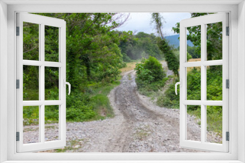 Fototapeta Naklejka Na Ścianę Okno 3D - Dirt road in a mountainous area