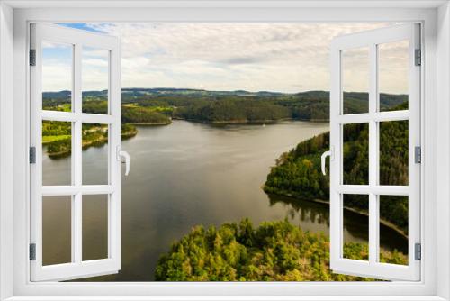 Fototapeta Naklejka Na Ścianę Okno 3D - The Orlik Reservoir on Vltava River is largest hydroelectric dam in Czech Republic. Aerial view to important source of sustainable energy in European Union.