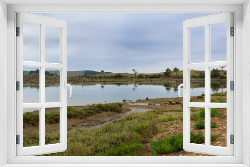 Fototapeta Naklejka Na Ścianę Okno 3D - Vistas panorámicas del paisaje reflejado en el agua del río Arroyo del Capitán en Cantabria, España, verano de 2020