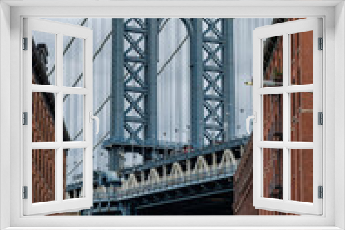 Fototapeta Naklejka Na Ścianę Okno 3D - The famous Manhattan bridge spanning the East River between Brooklyn and lower Manhattan