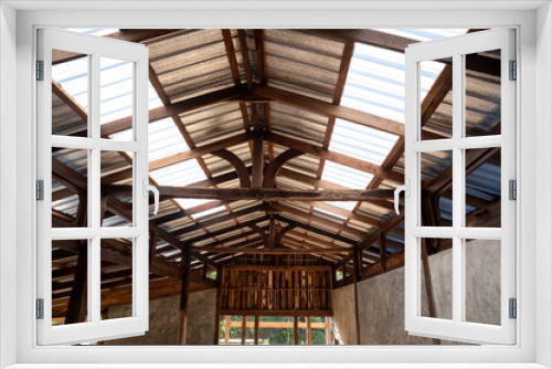 Fototapeta Naklejka Na Ścianę Okno 3D - Under the translucent wooden roof structure on construction site
