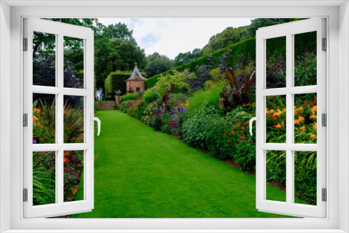 Fototapeta Naklejka Na Ścianę Okno 3D - A beautiful summer view of a traditional English garden