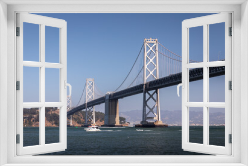 Fototapeta Naklejka Na Ścianę Okno 3D - Landscape of San Francisco - Oakland bay bridge with running boat.
