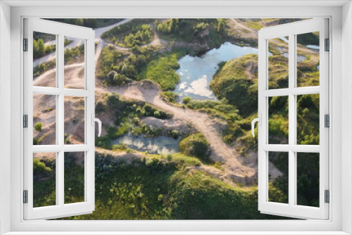 Fototapeta Naklejka Na Ścianę Okno 3D - Flooded and overgrown sand quarry. Lush green summer landscape for outdoors vacation, hiking, camping or tourism. Volokolamsk district of Moscow region. Sychevo beach, Russia
