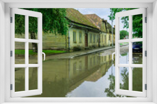 Fototapeta Naklejka Na Ścianę Okno 3D - Street with big water puddle.