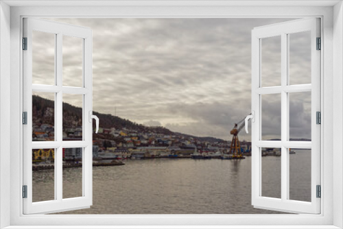 Fototapeta Naklejka Na Ścianę Okno 3D - Apartments, Houses and Maritime Buildings all mixed up with one another on the waterfront of Bergen Port under a winters sky.
