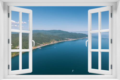 Fototapeta Naklejka Na Ścianę Okno 3D - Lake Baikal is a marvelous blue jewel framed by scenic mountains and forests. Epic cinematic aerial view Lake Baikal. Aerial view of blue lake and green forests.