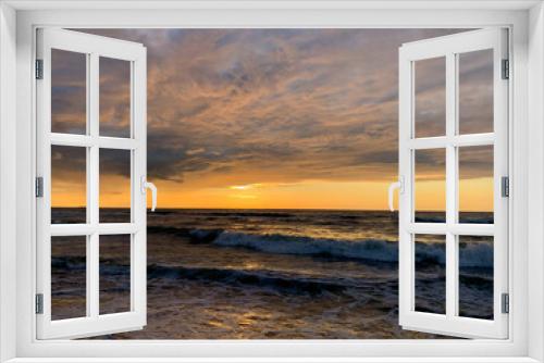 Fototapeta Naklejka Na Ścianę Okno 3D - Peaceful sunset at the sea, sand beach, yellow orange sunset