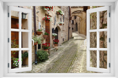 Fototapeta Naklejka Na Ścianę Okno 3D - narrow alley in the city of flowers (Spello) in Umbria