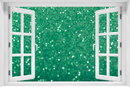 Fototapeta Naklejka Na Ścianę Okno 3D - Green glowing sequins blurred background