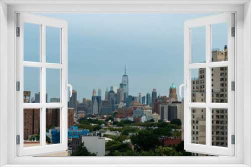 Fototapeta Naklejka Na Ścianę Okno 3D - The rooftops of Brooklyn and the skyscrapers of Manhattan