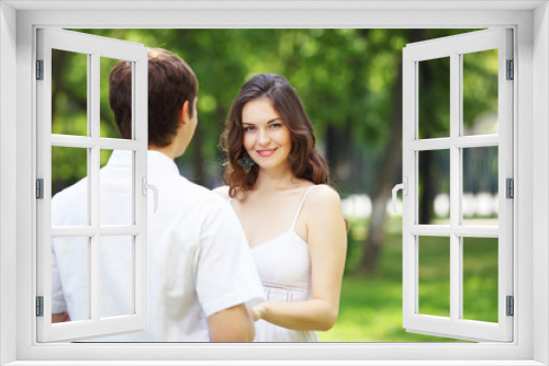 Young love Couple smiling under blue sky