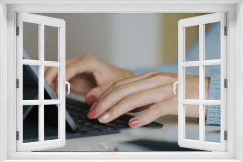 Fototapeta Naklejka Na Ścianę Okno 3D - Woman work on tablet computer at home
