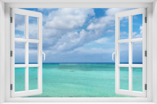 Fototapeta Naklejka Na Ścianę Okno 3D - View of a beach and sea in the Mexican Caribbean, a sunny day with crystal clear water.