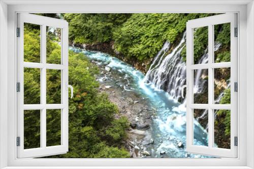 Fototapeta Naklejka Na Ścianę Okno 3D - waterfall in the forest with blue liver in Hokkaido Japan