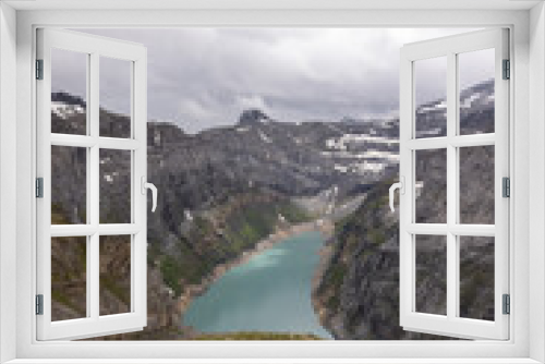 Fototapeta Naklejka Na Ścianę Okno 3D - Amazing alpine lake called Limmerensee in the heart of canton Glarus in Switzerland. Epic view from the top of the mountain. Wonderful hiking day with good weather conditions.