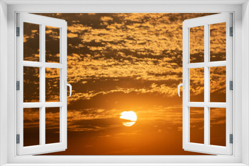 Fototapeta Naklejka Na Ścianę Okno 3D - Golden clouds in dramatic light at sunset