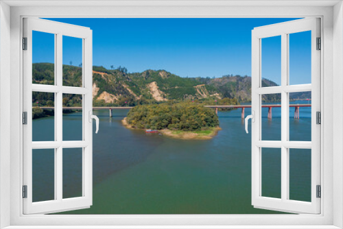 Fototapeta Naklejka Na Ścianę Okno 3D - Rio Maule, constitucion, chile, horizontal aerial view with drone of the river and city bridge