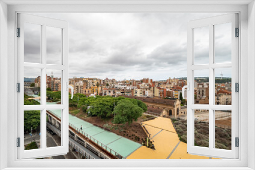 Fototapeta Naklejka Na Ścianę Okno 3D - View from above of area Mercat Nou in Barcelona, District Sants. Walking street and buildings of big city