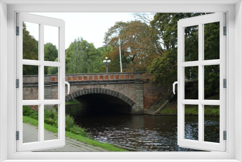 Fototapeta Naklejka Na Ścianę Okno 3D - The bridge on the canal in the park of Riga. High quality photo