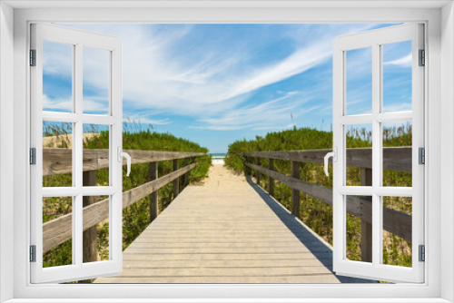 Fototapeta Naklejka Na Ścianę Okno 3D - Wooden boardwalk over the dunes to the sea