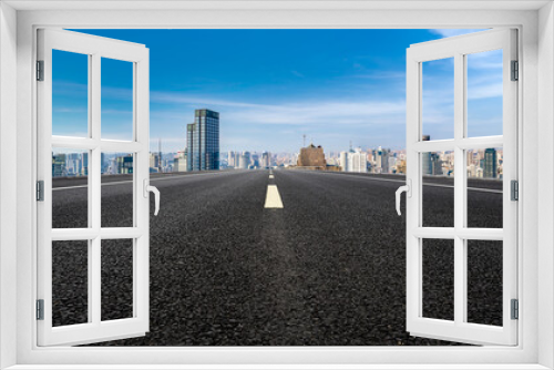 Fototapeta Naklejka Na Ścianę Okno 3D - Panoramic skyline and empty asphalt road with modern buildings