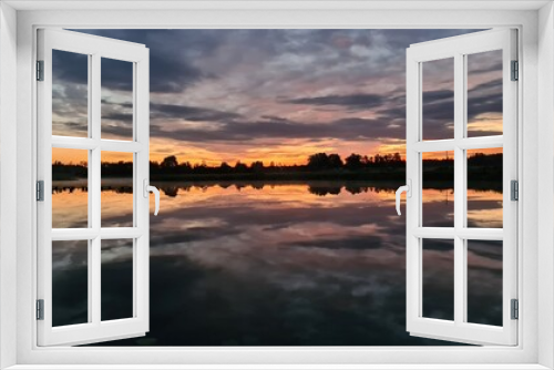 Fototapeta Naklejka Na Ścianę Okno 3D - evening on the lake with beautiful reflections of clouds