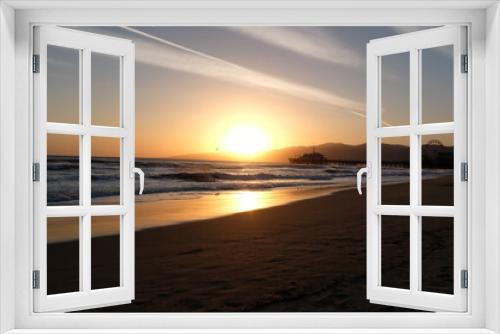Fototapeta Naklejka Na Ścianę Okno 3D - Sunset at Santa Monica Beach, California. The golden color of the sand.