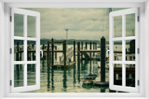 Fototapeta Naklejka Na Ścianę Okno 3D - Vintage photo of Russel Wharf on a stormy day. Low tide