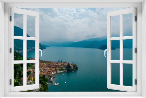 Fototapeta Naklejka Na Ścianę Okno 3D - Aerial view of Varenna village. Varenna is a picturesque and traditional village on a cloudy day, located on the eastern shore of Lake Como, Italy