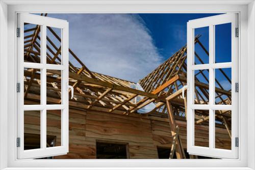 Fototapeta Naklejka Na Ścianę Okno 3D - In progress construction of a wooden house