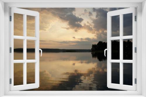 Fototapeta Naklejka Na Ścianę Okno 3D - Quiet evening over the lake. The magic of the sunset and the charm of nature. Beautiful view.