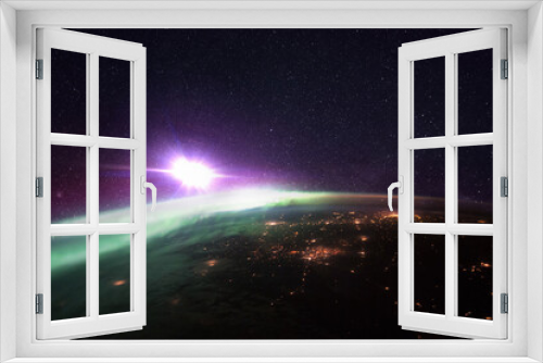 Fototapeta Naklejka Na Ścianę Okno 3D - Night planet earth with amazing green polar lights and purple starry space with a bright star. Bright city lights of megacities, view from space
