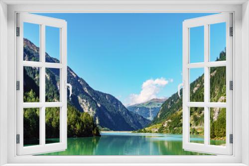 Fototapeta Naklejka Na Ścianę Okno 3D - Blick auf einen Stausee in einem Bergtal / Stillup Tirol