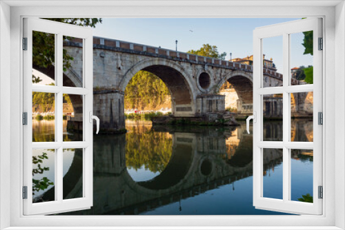 Along the banks of the Tiber River in Rome. Ancient bridges