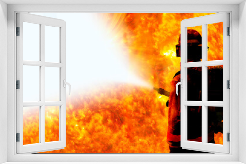Fototapeta Naklejka Na Ścianę Okno 3D - Silhouette of Firemen fighting a raging fire with huge flames of burning with work space  Elements of this image are furnished by NASA