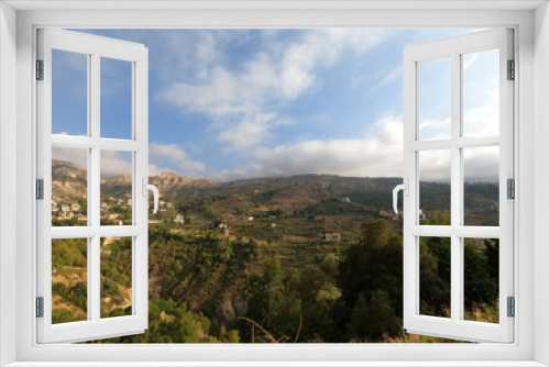 Village and mountain view. Summertime