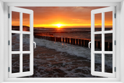 Fototapeta Naklejka Na Ścianę Okno 3D - Beautiful sunset over the sea with red reflexes on clouds 