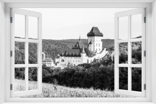 Fototapeta Naklejka Na Ścianę Okno 3D - Karlstejn - Gothic Royal Castle in Central Bohemia founded in 1348 by Charles IV, Holy Roman Emperor and King of Bohemia. Czech Republic. Black and white image.
