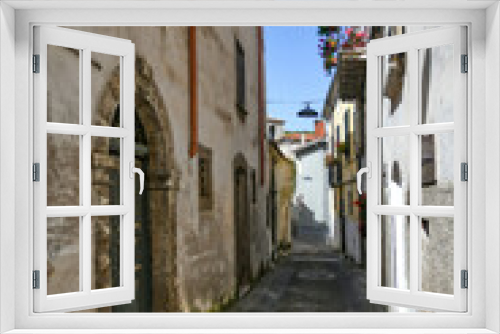 Fototapeta Naklejka Na Ścianę Okno 3D - A narrow street in Carpinone, a medieval town of Molise region, Italy.