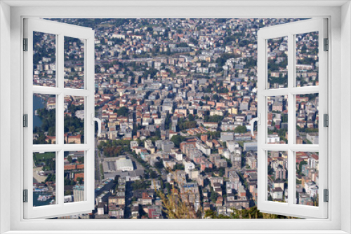 Aerial view of bay of Lake Lugano on a sunny late summer morning. Photo taken September 11th, 2021, Lugano, Switzerland.