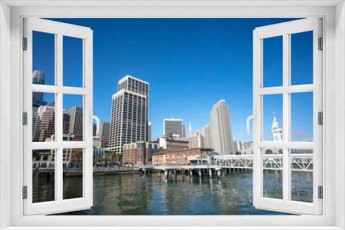Fototapeta Naklejka Na Ścianę Okno 3D - The San Francisco, california, Skyline as Seen From the Waterfront with tall Sky Scrapers and a Blue Sky