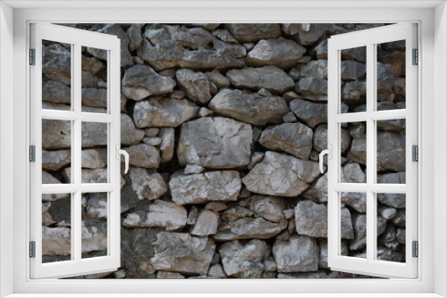 Fototapeta Naklejka Na Ścianę Okno 3D - Wall of natural stones of gray color