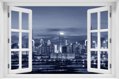 Fototapeta Naklejka Na Ścianę Okno 3D - Night scenery of panorama of skyline of Shenzhen city, China. Viewed from Hong Kong border