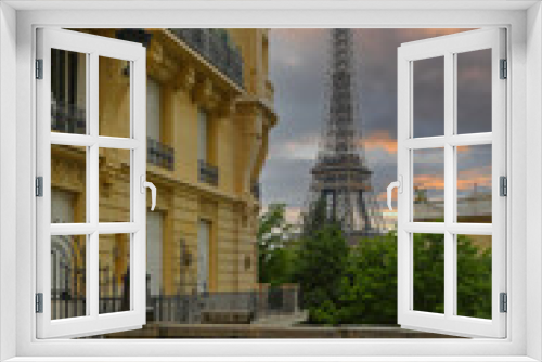 Fototapeta Naklejka Na Ścianę Okno 3D - View of Eiffel Tower on street in Paris. Eiffel Tower is an architecture and landmark of Paris.